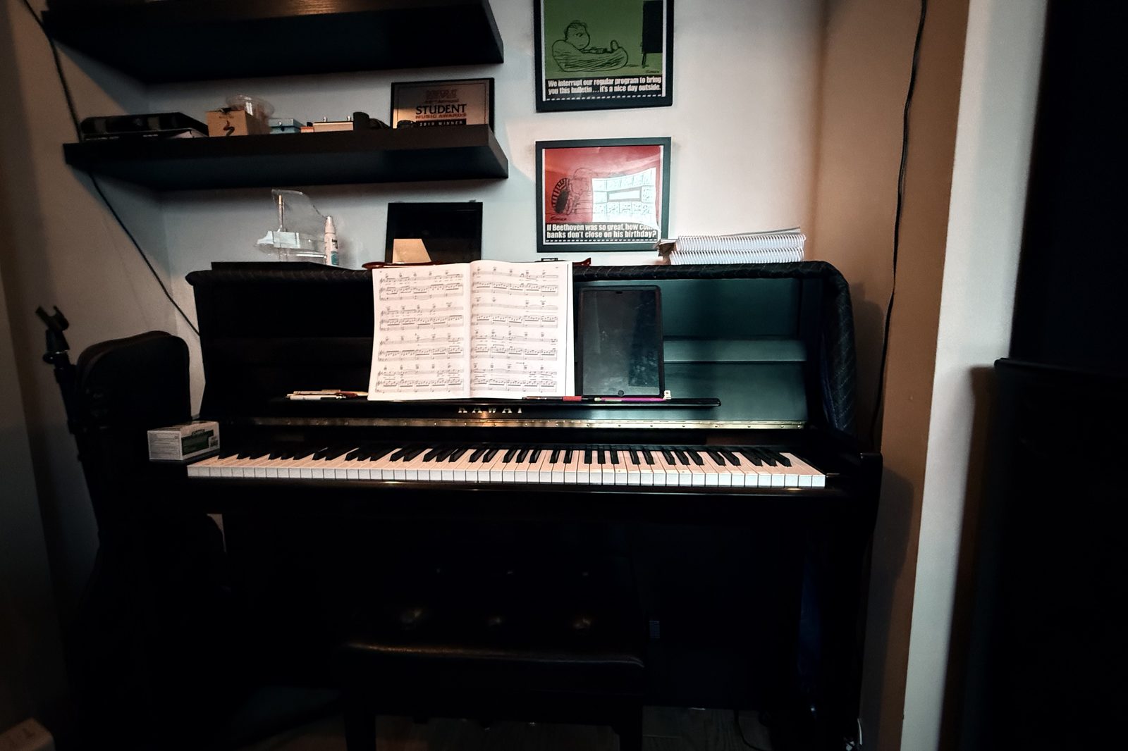 Upright piano with open sheet music at the Music with Nick studio in Chicago